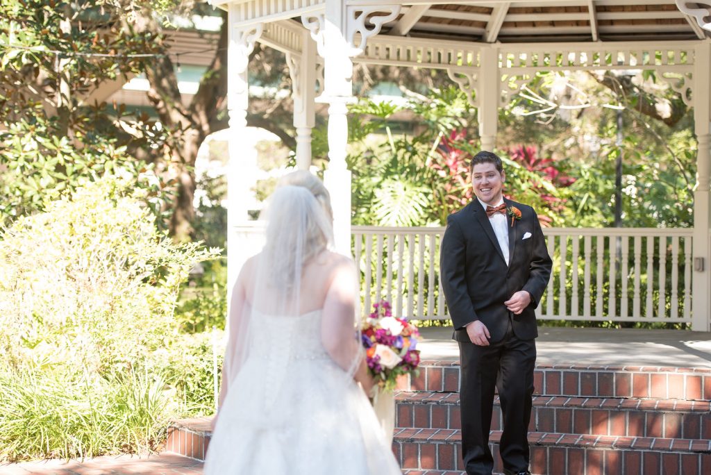 First Look Bride & Groom Courtyard at Lake Lucerne | Classic Purple & Orange Wedding Football Texas Longhorns Sports Lake Lucerne Courtyard Anna Christine Events Orlando Kathy Thomas Photography