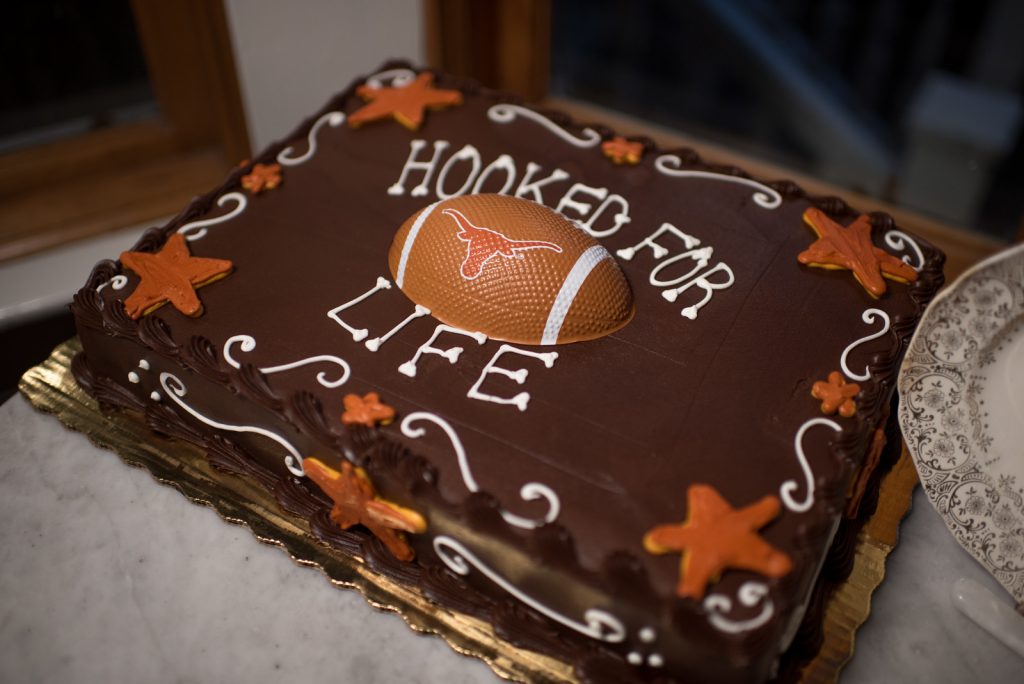 Hooked for Life Publix Bakery Groom's Cake Football Texas Longhorns | The Courtyard at Lake Lucerne Classic Purple & Orange Wedding Football Texas Longhorns Sports Lake Lucerne Courtyard Anna Christine Events Orlando Kathy Thomas Photography