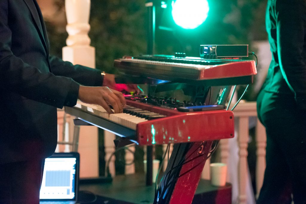 The Bay Kings Band Live Band Piano | The Courtyard at Lake Lucerne Classic Purple & Orange Wedding Football Texas Longhorns Sports Lake Lucerne Courtyard Anna Christine Events Orlando Kathy Thomas Photography