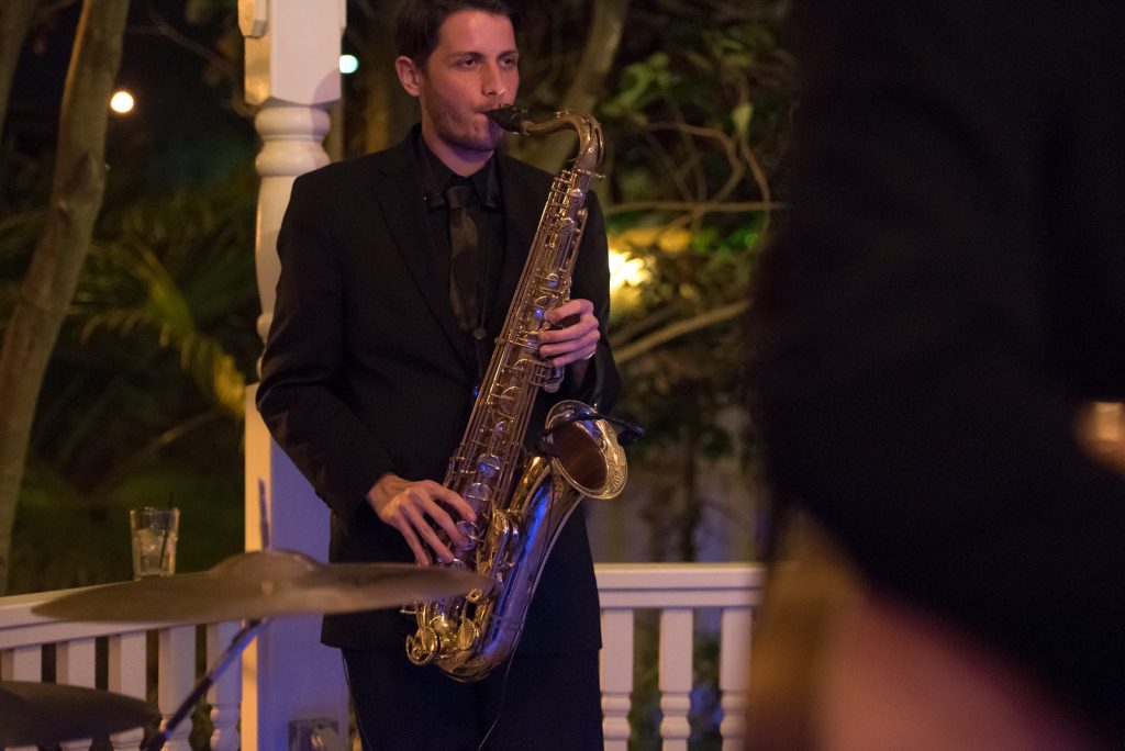 The Bay Kings Band Live Band Saxophone | The Courtyard at Lake Lucerne Classic Purple & Orange Wedding Football Texas Longhorns Sports Lake Lucerne Courtyard Anna Christine Events Orlando Kathy Thomas Photography