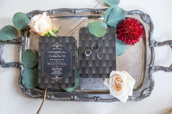 invitations from classic black and white wedding with touches of red