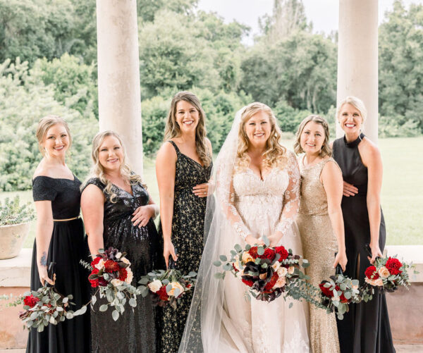 bridesmaids pose for pictures at howey mansion wedding