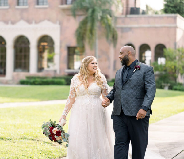 interracial bride and groom on wedding day at howey mansion