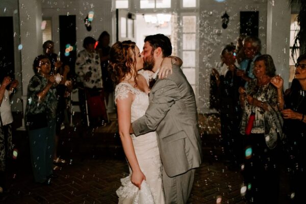 couple kisses in bubble exit planned by anna christine events at cypress grove estate orlando wedding